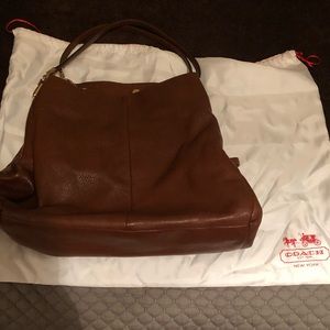 Authentic 3 pocket brown leather coach purse.